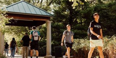 Students walking on bridge